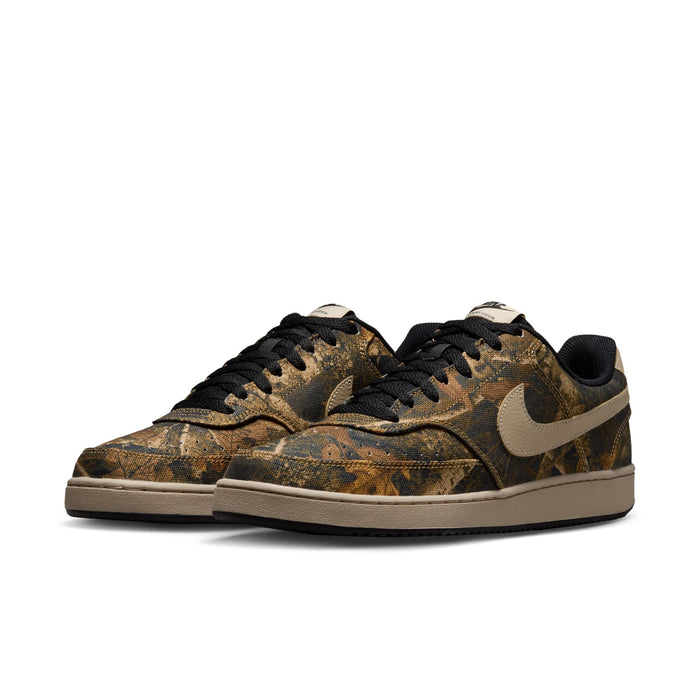 Men's low-top sneakers with brown camo upper, black laces, and tan accent sole.