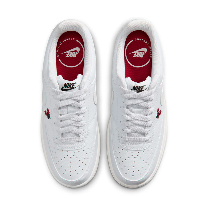 Off-white low-top sneakers with white laces and red-lined Nike tongue labels