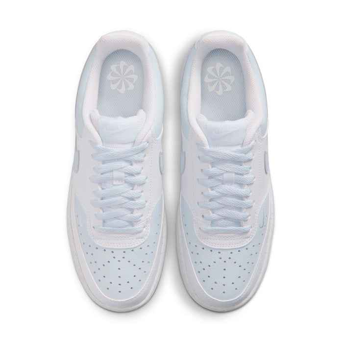 Women's white low-top sneakers, top view of two shoes with light blue lining.