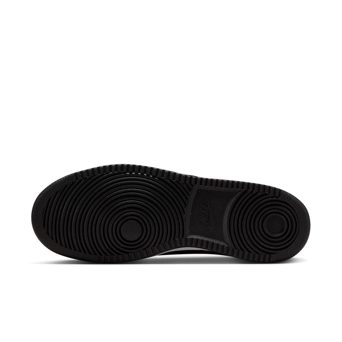 Women's sneaker outsole in black rubber with circular traction tread.