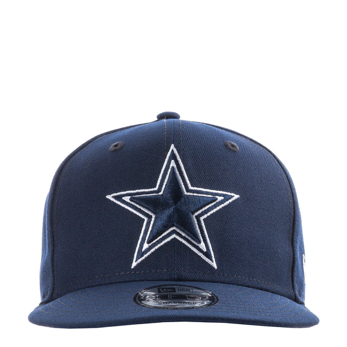 Navy baseball cap with white star logo on front