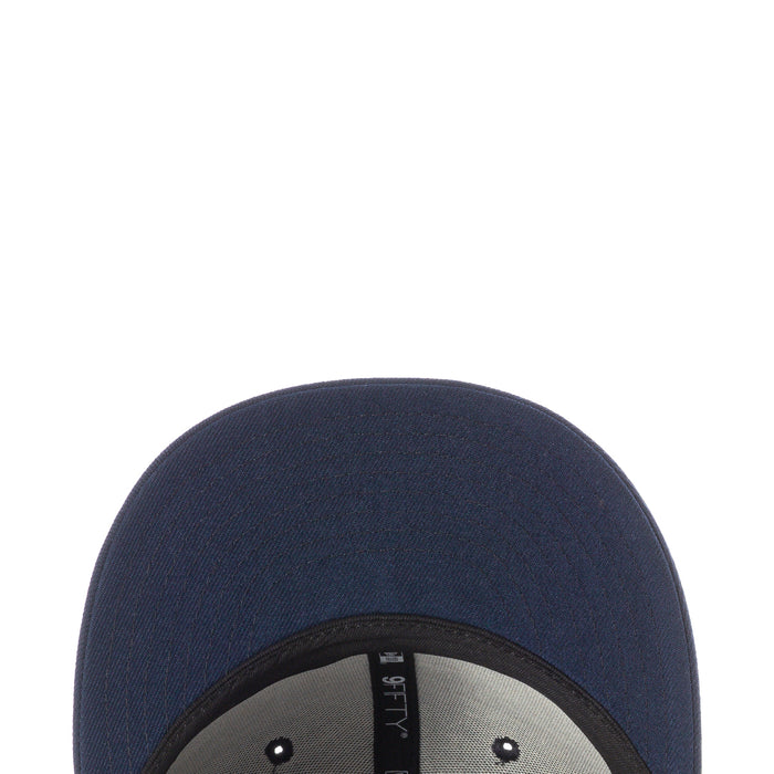 Navy baseball cap top view with inner snapback strap