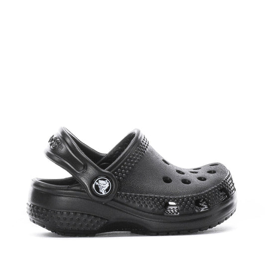 Infant black slip-on clog with perforated upper and adjustable heel strap, Crocs logo