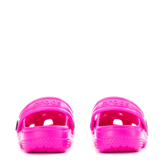 Bright pink infant Crocs clogs shown from the back with strap loops
