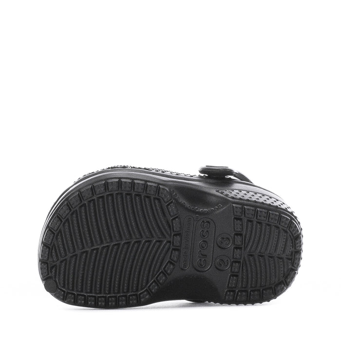 Infant black clog outsole with textured tread pattern