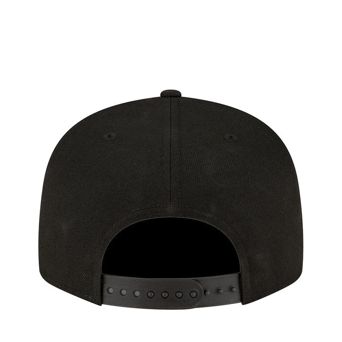 Black baseball cap back view with ventilation eyelets and snapback adjuster.