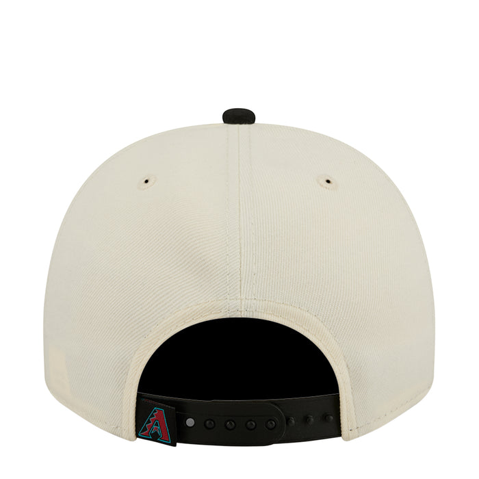 Cream A-frame baseball cap back with ventilation eyelets and black under-strap
