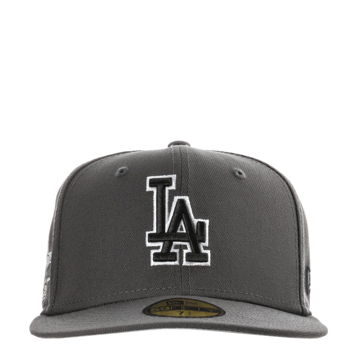 Dark graphite baseball cap with large white-outlined LA logo on front panel