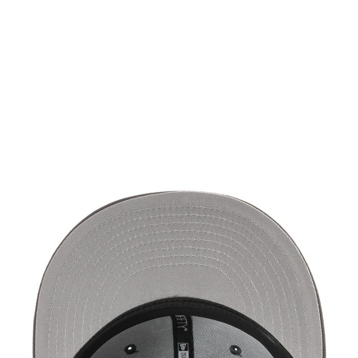 Baseball cap underside view with stitched brim and dark inner band