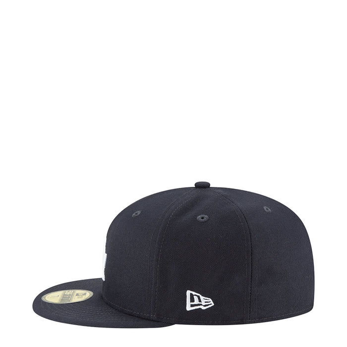 Navy baseball cap with New Era logo on front panel