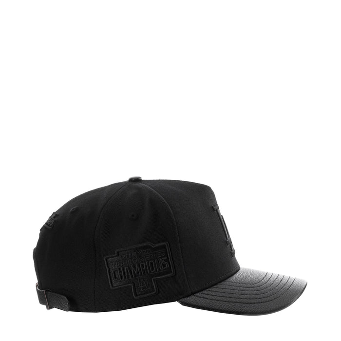 Black pinch-front strapback cap with side league patch and curved gray brim