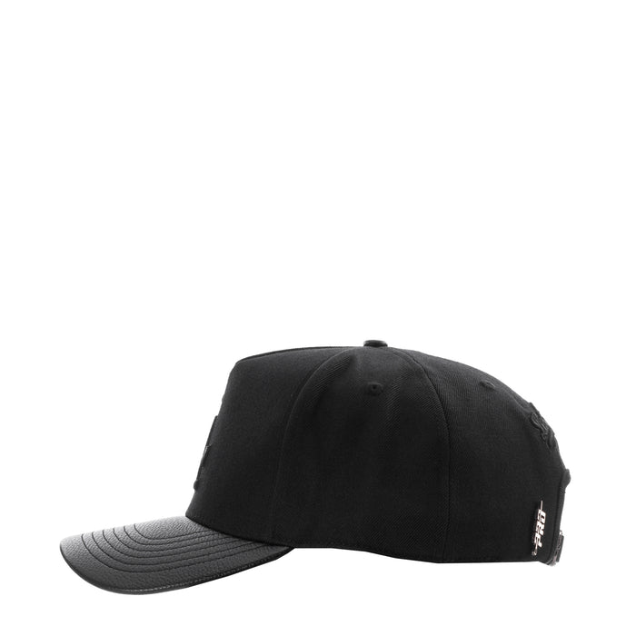 Black strapback baseball cap with side embroidery patch and curved gray brim