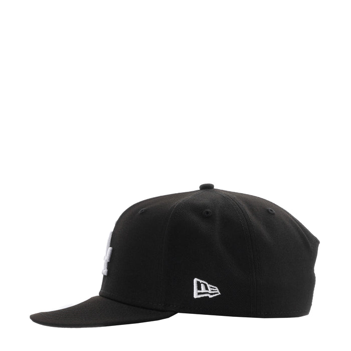 Black baseball cap with New Era flag logo on front panel
