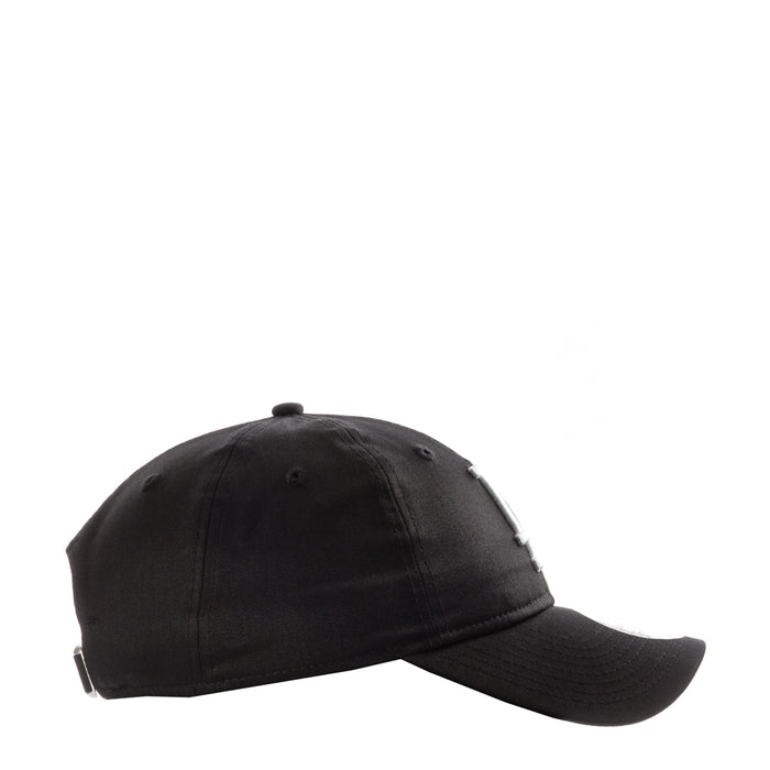 Black baseball cap with curved brim and top button, side view