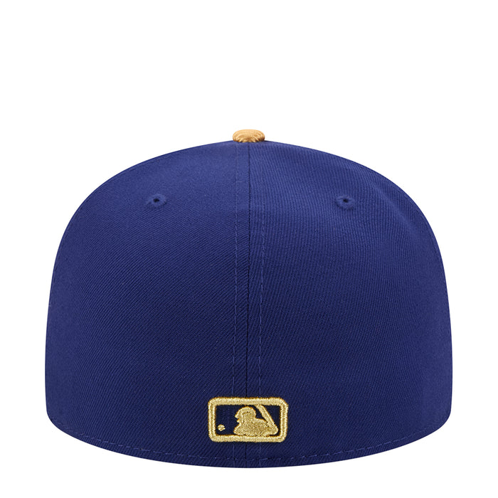 Navy baseball cap with gold MLB batter patch on the back