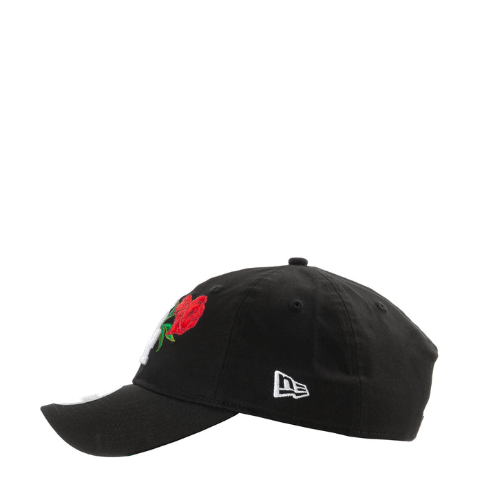Black baseball cap with red rose applique and white New Era logo on side