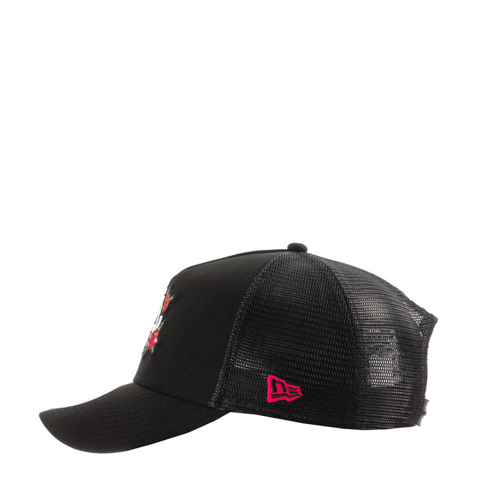 Black trucker cap with red 'De' logo on side and rose embroidery