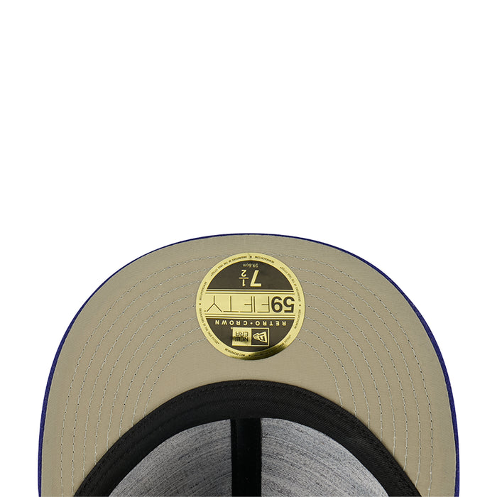 Light tan baseball cap with circular sticker patch on top and black inner band