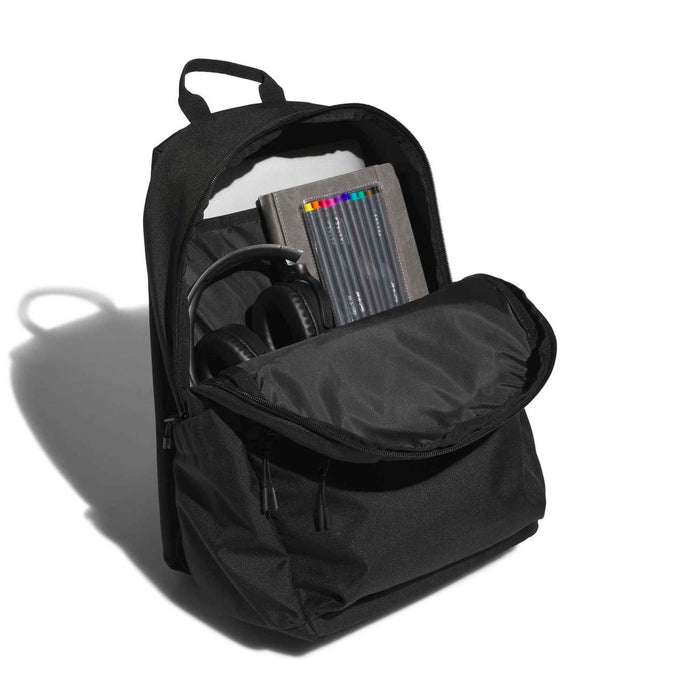 Black backpack opened to show laptop sleeve and interior organizer compartments