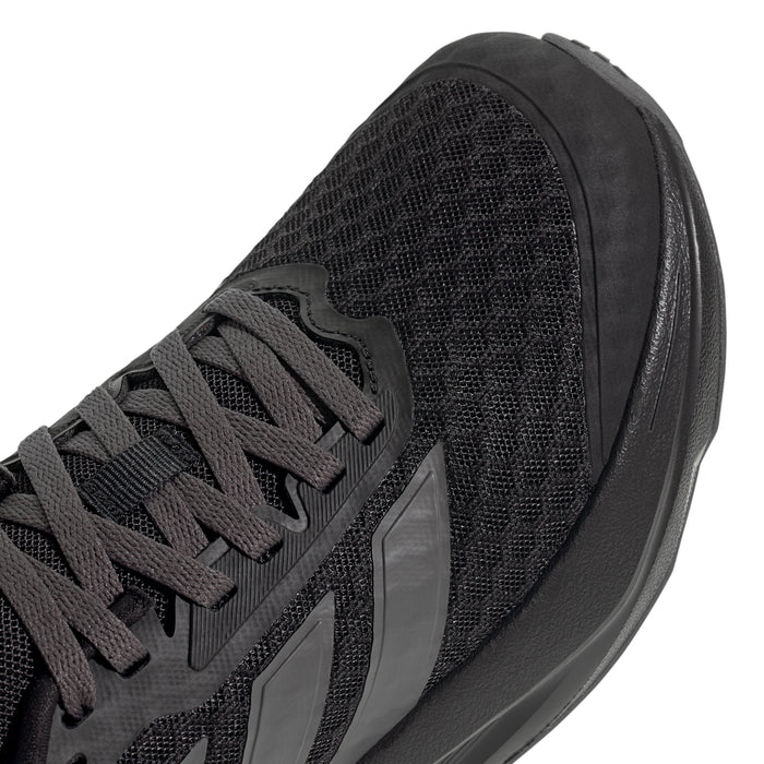 Youth running shoe close-up, black textured mesh upper with gray stripe overlays