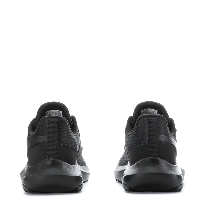 Women’s black sneakers, rear view with pull tab and cushioned sole