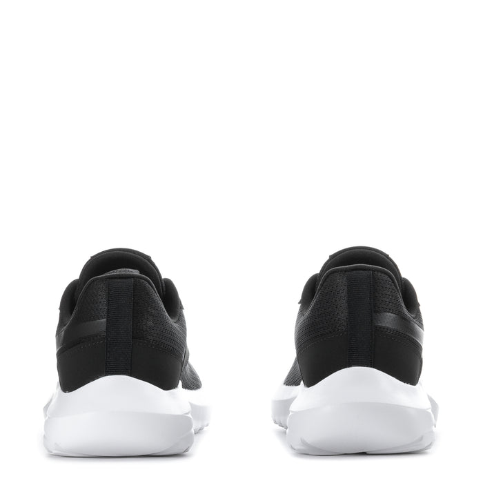 Youth black sneakers heel view with cushioned collar and white sole
