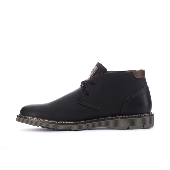 Men's black leather chukka boot with lace-up, side stitching, and brown tab