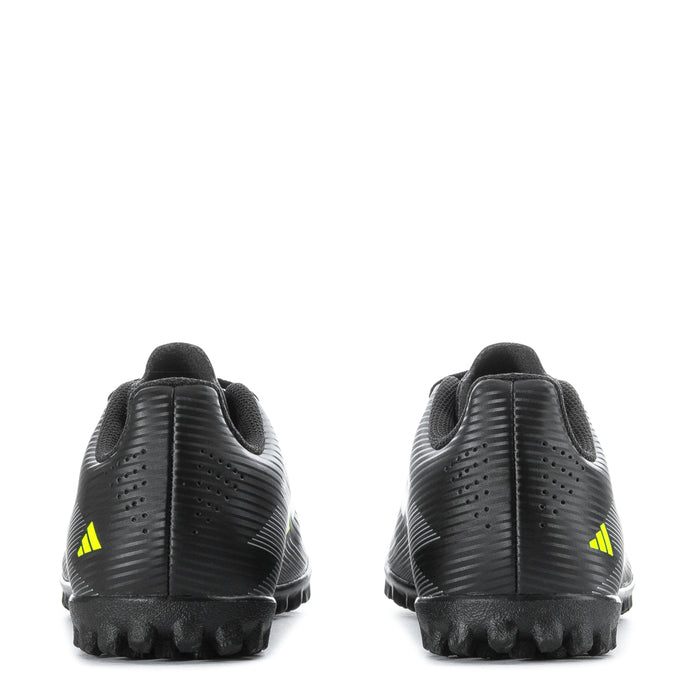 Youth black soccer cleats rear view with neon green heel accents and rubber stud sole