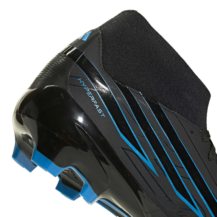 Close-up of men's mid-cut black soccer cleat side, showing blue stripes and heel
