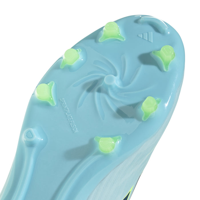 Close-up of youth cleat outsole with molded studs in light blue and lime accents