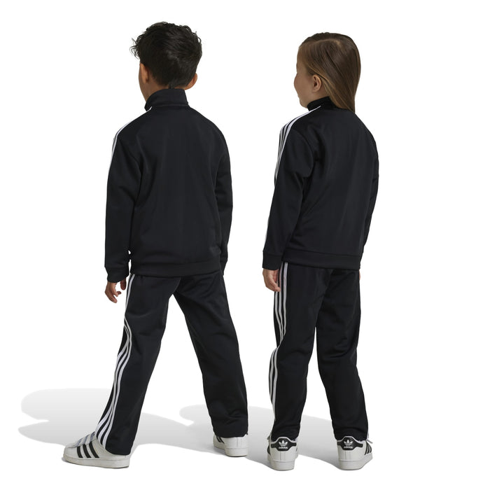 Kids black track set with white stripes, back view of jacket and matching pants