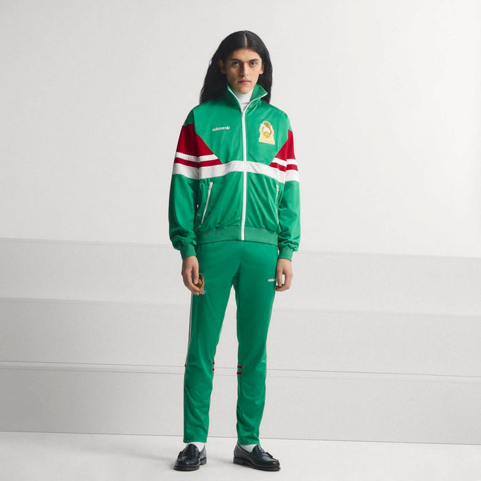 Green track jacket with stand collar, zip front, red/white sleeve stripes