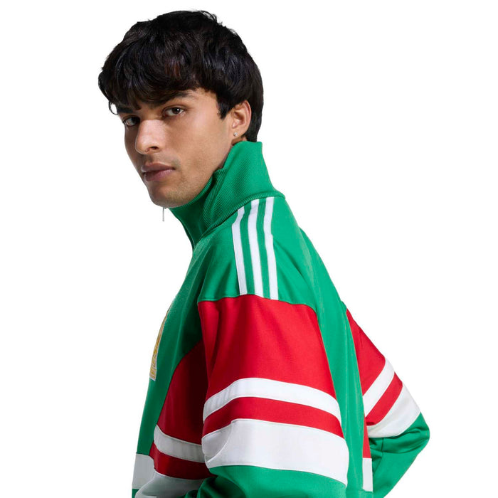 Green track jacket with red and white striped shoulder and sleeves
