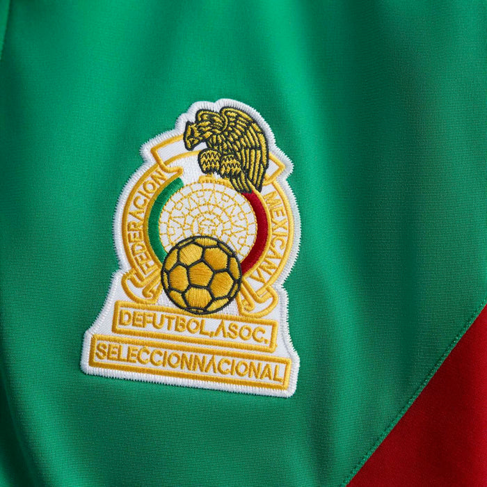 Green track jacket fabric with soccer crest patch badge