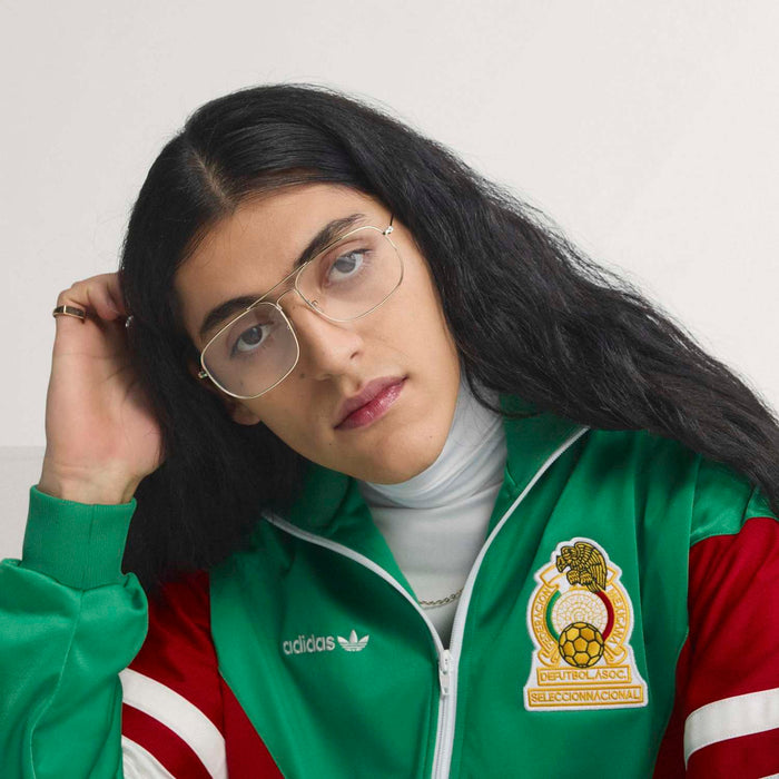 Green track jacket with adidas logo and soccer crest patch, zip front