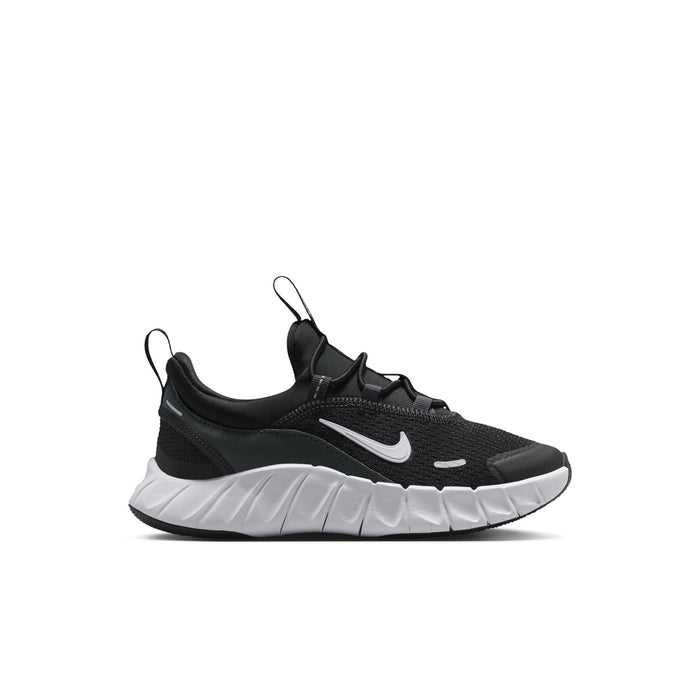 Kids' black and white sneakers with cushioned sole and Nike Swoosh
