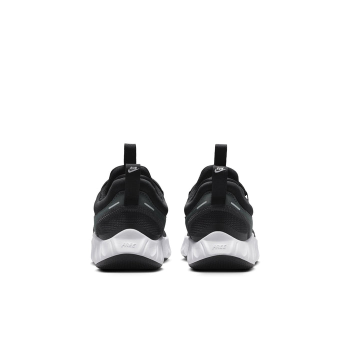 Kids' black sneakers from the back with white midsole and pull tabs
