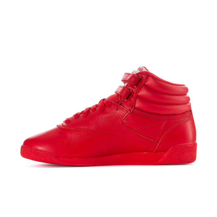 Red high-top sneaker side view with laces, hook-and-loop strap, and Reebok logo