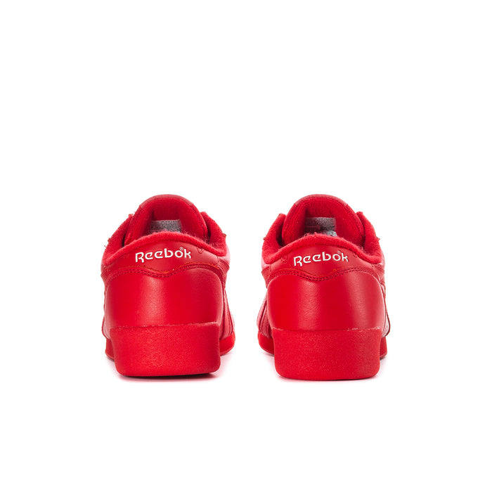 Women’s red Reebok low-top sneaker heels with rear logo patch