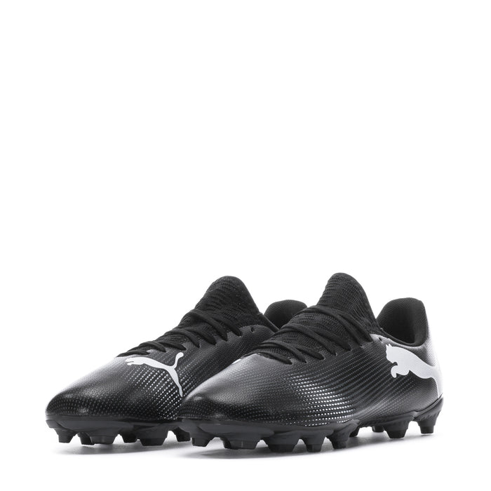 Youth black soccer cleat with white side Puma cat logo and molded studs