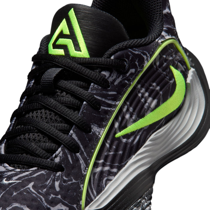 Youth black shoe close-up with volt-green logo and lace-up details