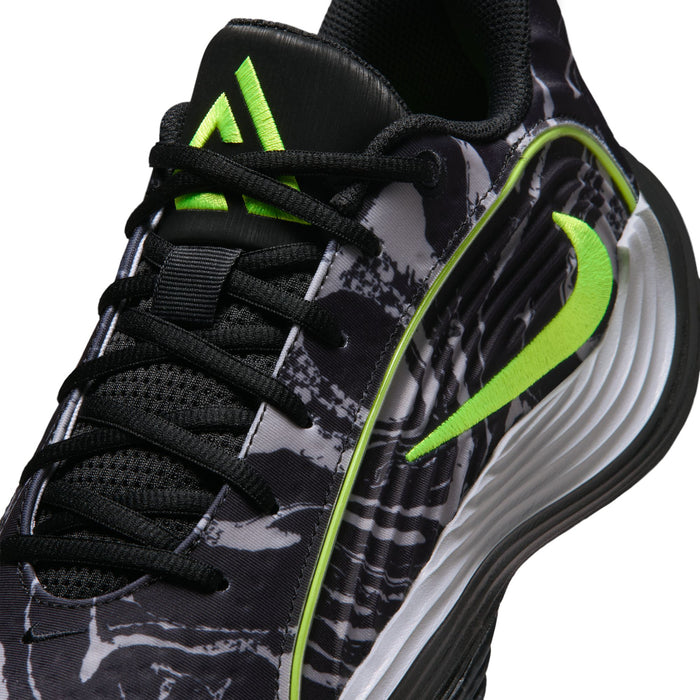 Close-up of black mens shoe upper with laces, camo print, and volt green accents