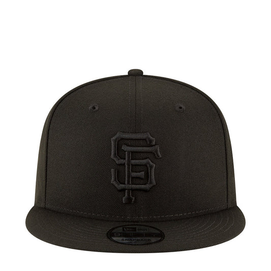 Black baseball cap with front Giants logo patch and curved brim