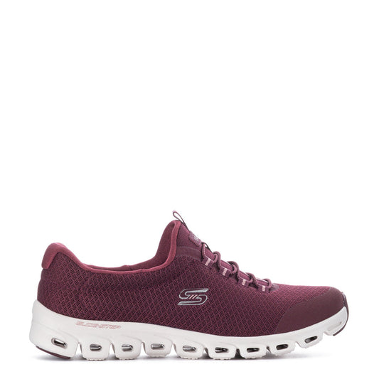 Burgundy knit lace-up women’s running shoe with white cushioned sole and tread pods