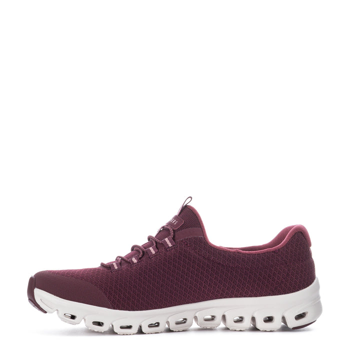 Burgundy lace-up running shoe, textured upper and white outsole with pod-like openings
