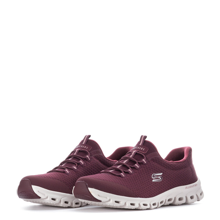 Burgundy sneakers with lace-up front, mesh texture, and white soles with molded pods