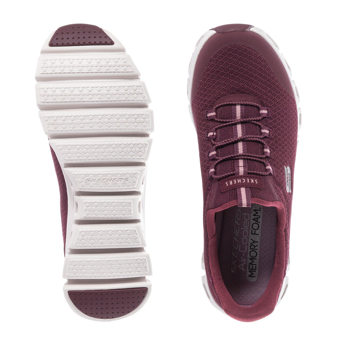 Burgundy lace-up shoe viewed from side and sole; white tread outsole