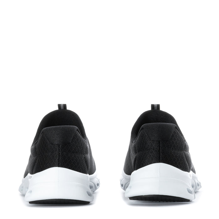 Black women's sneakers with white heel cushioning and rear loop detail