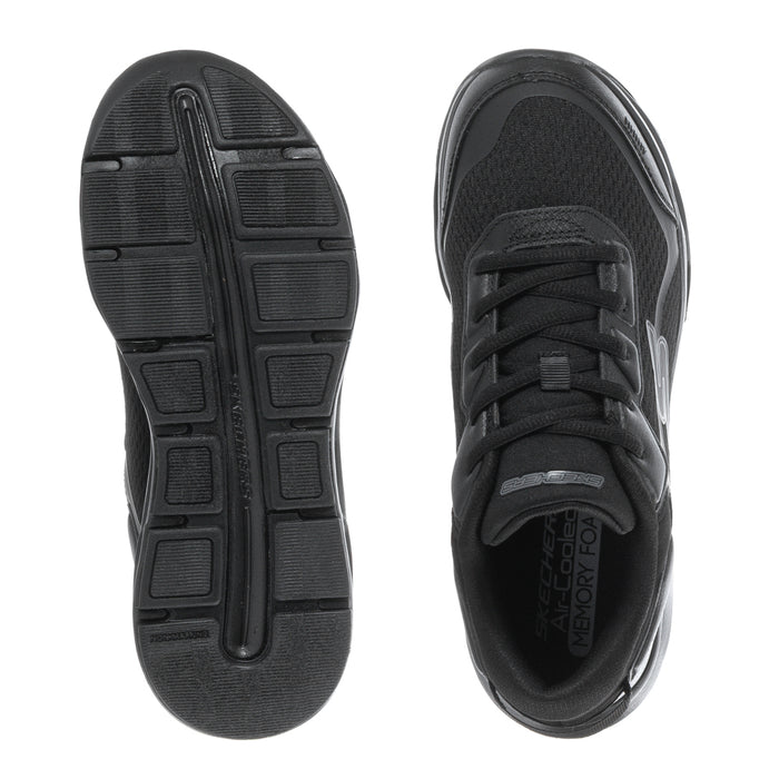 Black youth sneaker outsoles with tread pattern and lace-up upper view