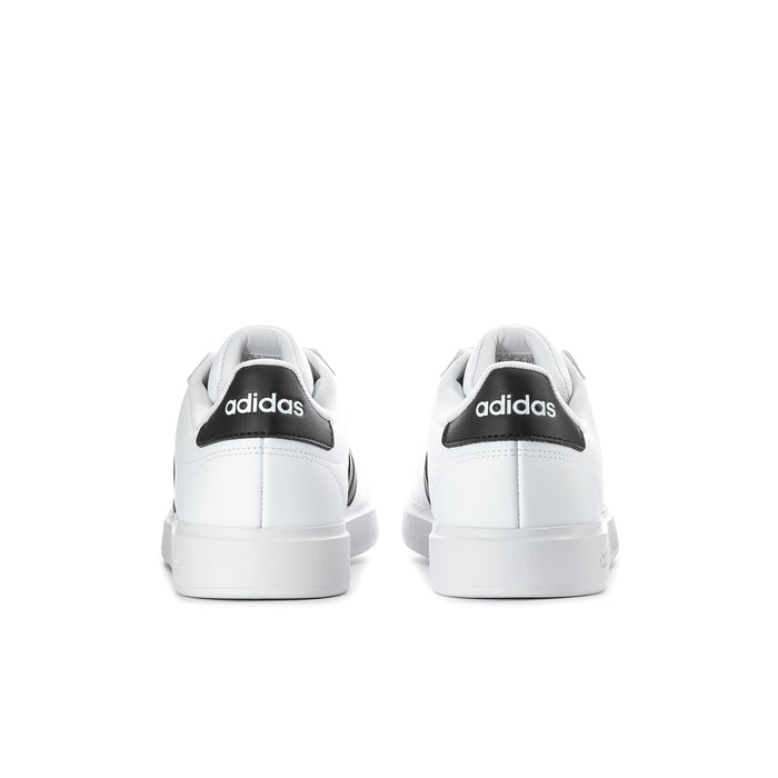 Men's white low-top sneakers, rear view with adidas heel tab